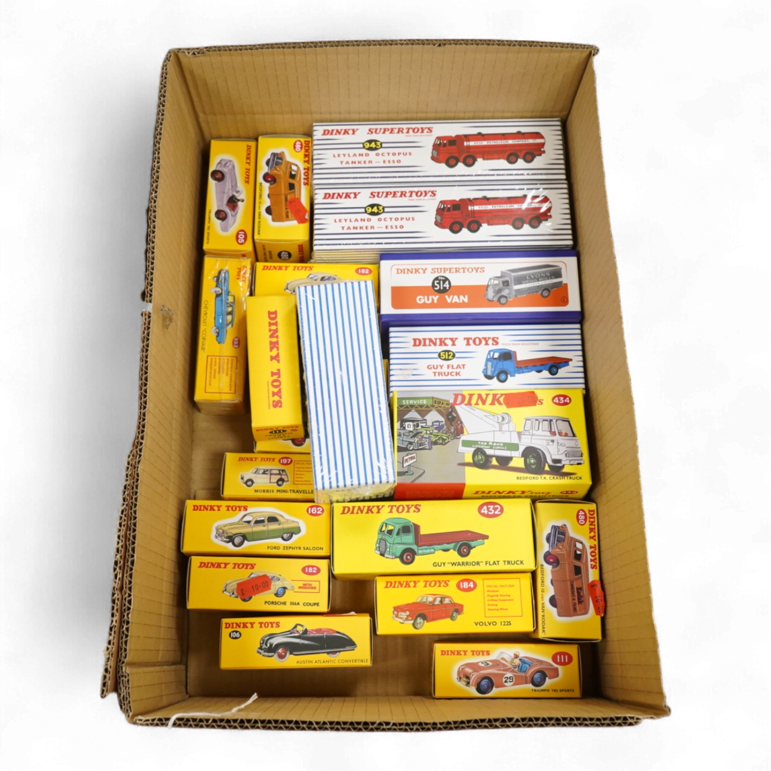 Twenty-two boxed Atlas Dinky Toys, including cars and commercial vehicles, Leyland tankers, sports cars, etc.